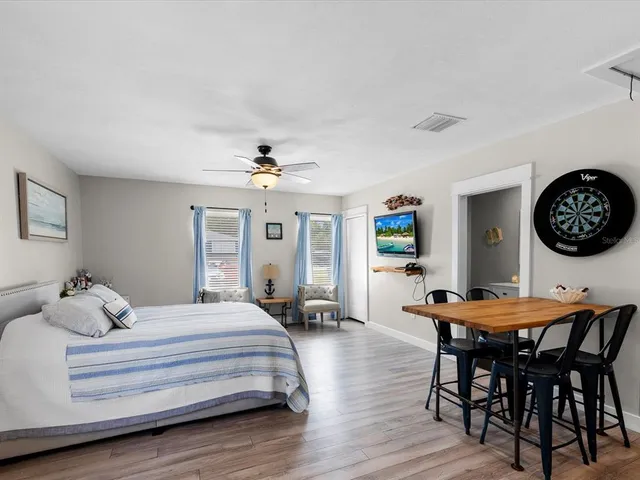 a view of a backyard with sitting area