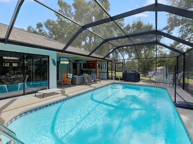 a view of a golf course with a lake in the background