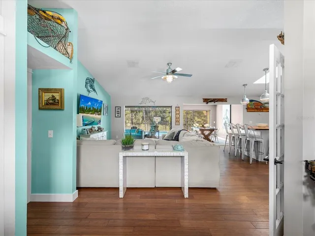 a kitchen with stainless steel appliances a sink a stove top oven a counter space and cabinets