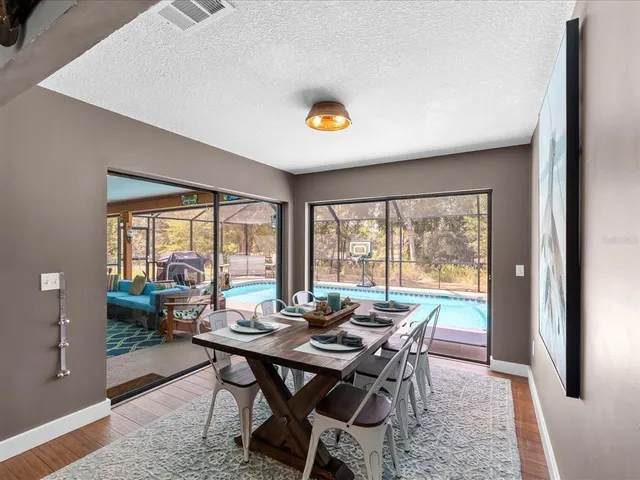 a kitchen with stainless steel appliances a refrigerator and a stove