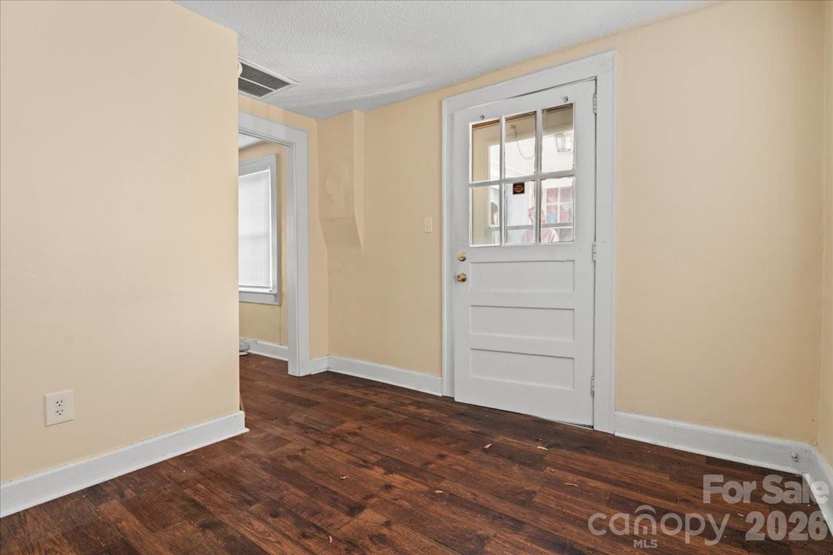 501 Church Street Cheraw, SC 29520 - Photo 25 of 48 an empty room with wooden floor cabinet and closet