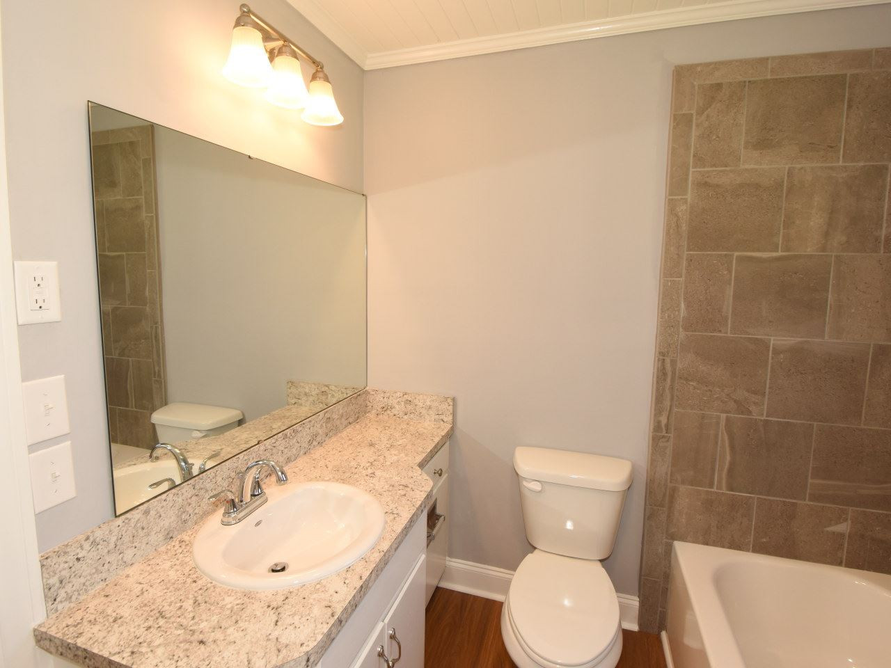 1525 Micro Road Selma, NC 27576 - Photo 16 of 25 Updated vanity, tub/shower/tile,, new flooring, fresh paint, new lighting fixtures. Bathroom