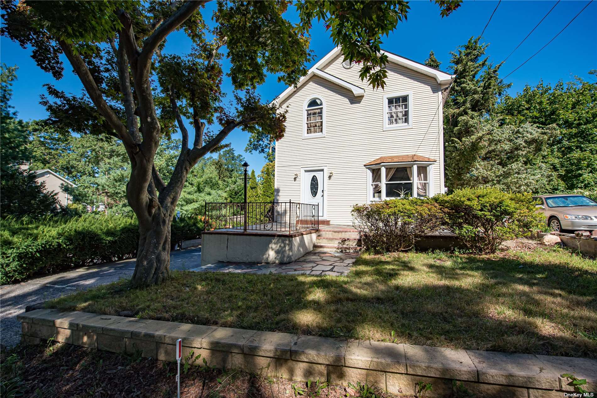 117 Freya Road Rocky Point, NY 11778 - Photo 1 of 1 a view of a white house with a yard and outdoor seating