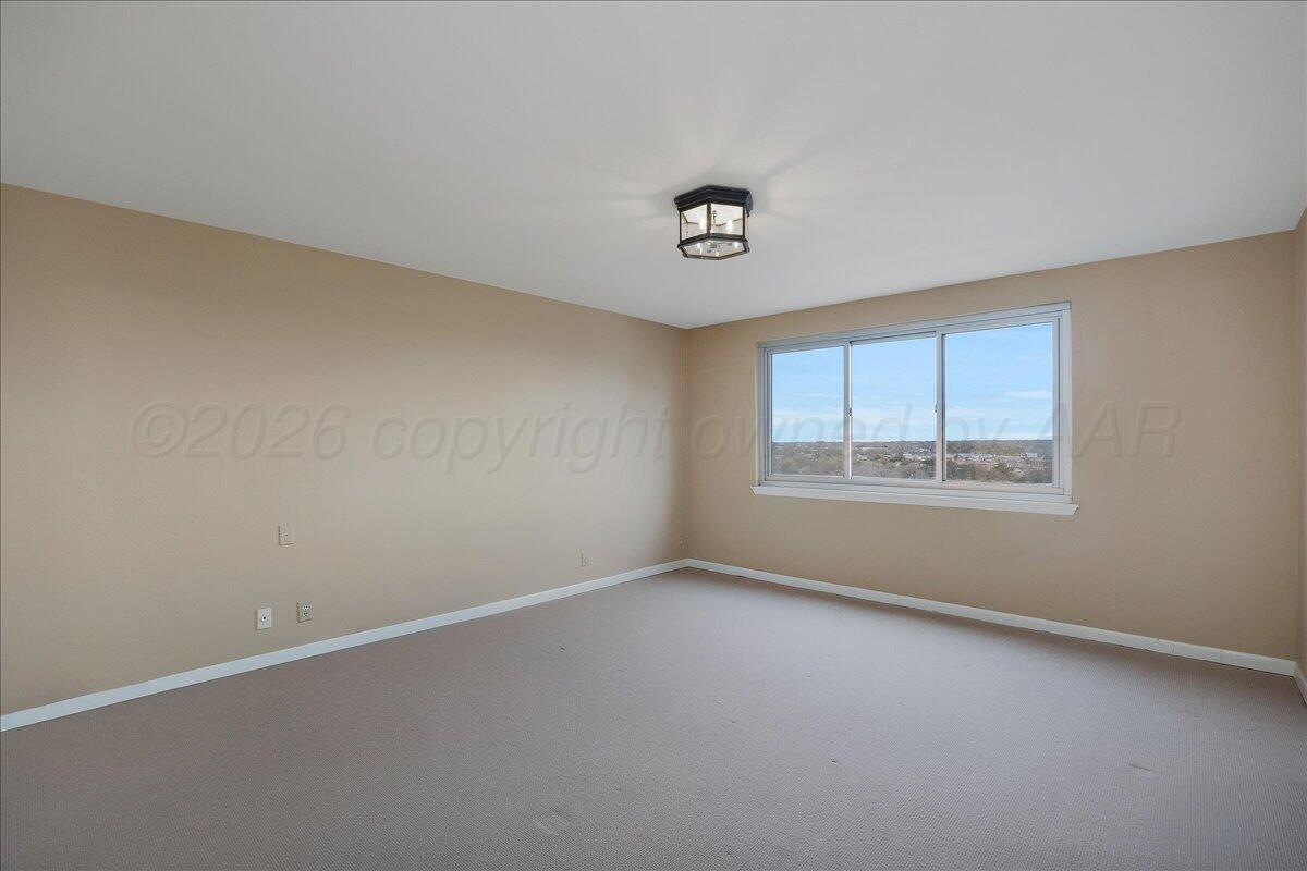 2028 South Austin Street, Unit 907 Amarillo, TX 79109 - Photo 22 of 39 an empty room with a window
