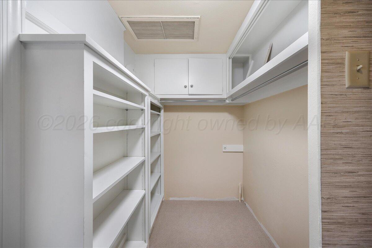 2028 South Austin Street, Unit 907 Amarillo, TX 79109 - Photo 25 of 39 a view of an empty walk in closet