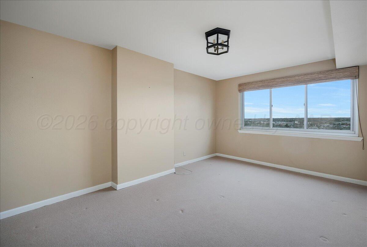2028 South Austin Street, Unit 907 Amarillo, TX 79109 - Photo 26 of 39 an empty room with a window