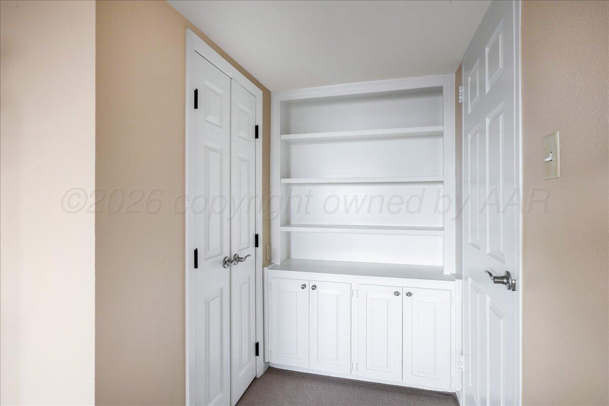 2028 South Austin Street, Unit 907 Amarillo, TX 79109 - Photo 27 of 39 a view of walk in closet with empty racks