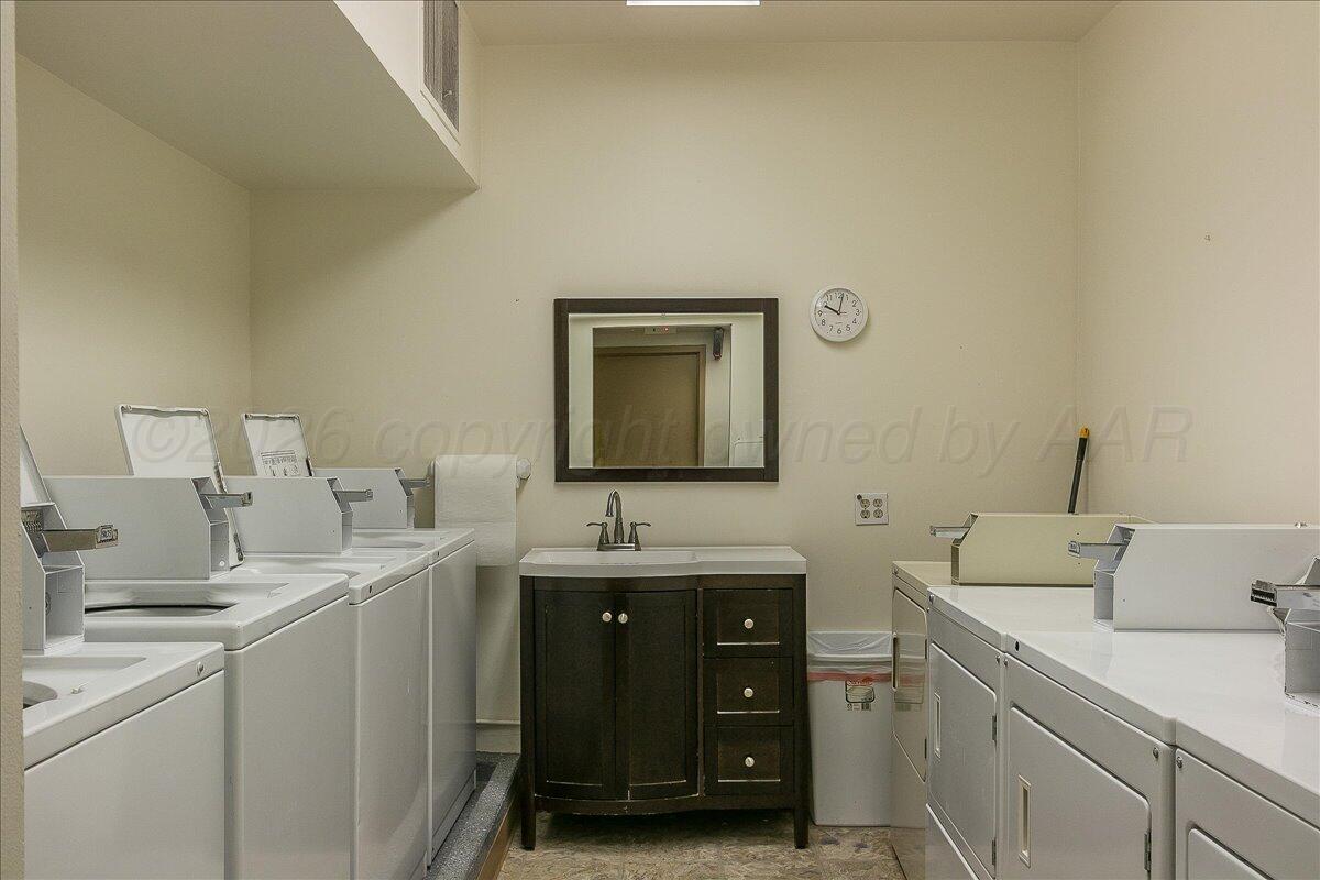 2028 South Austin Street, Unit 907 Amarillo, TX 79109 - Photo 38 of 39 a room with a sink and a mirror