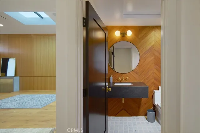 a bathroom with a sink and a mirror