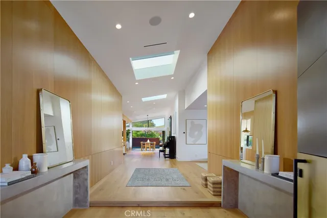 a living room with a couch and a wooden floor