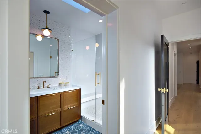 a bedroom with a bed and a mirror