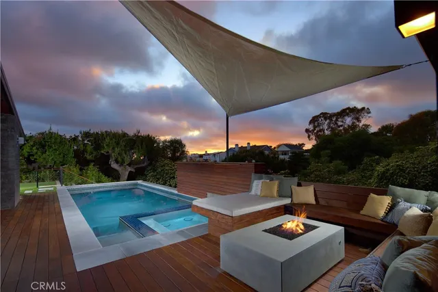 a kitchen with stainless steel appliances wooden floor and a large window