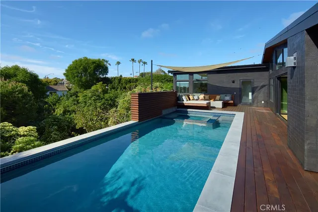 a view of a backyard with sitting area