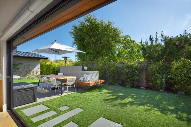 a patio with a table and chairs
