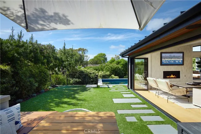 a backyard of a house with lots of trees