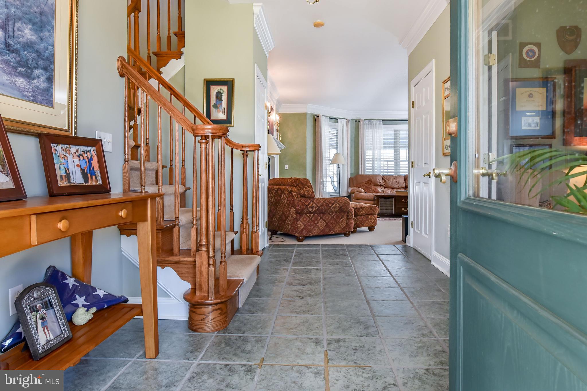 Foyer leading to open floor plan