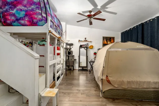 a view of an entryway with wooden floor