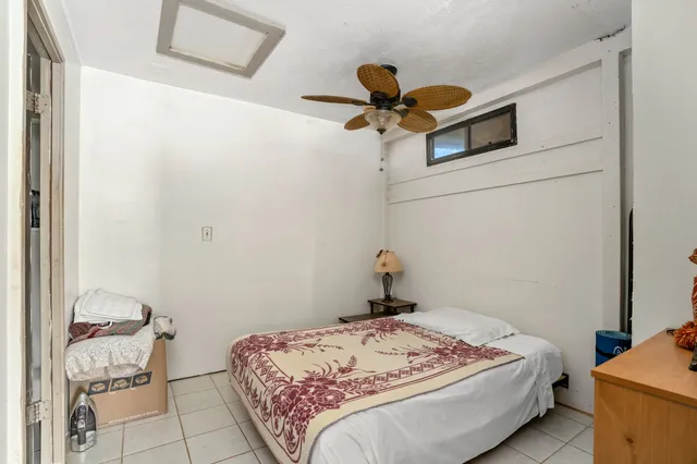 a bedroom with a bed and a table in it