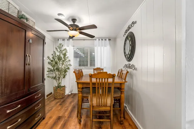 a dining room with furniture and window