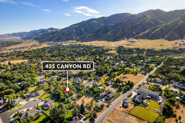 435 Canyon Road Millville, UT 84326 - Photo 106 of 113 Aerial perspective showcasing a residential area with varied home styles and mature landscaping