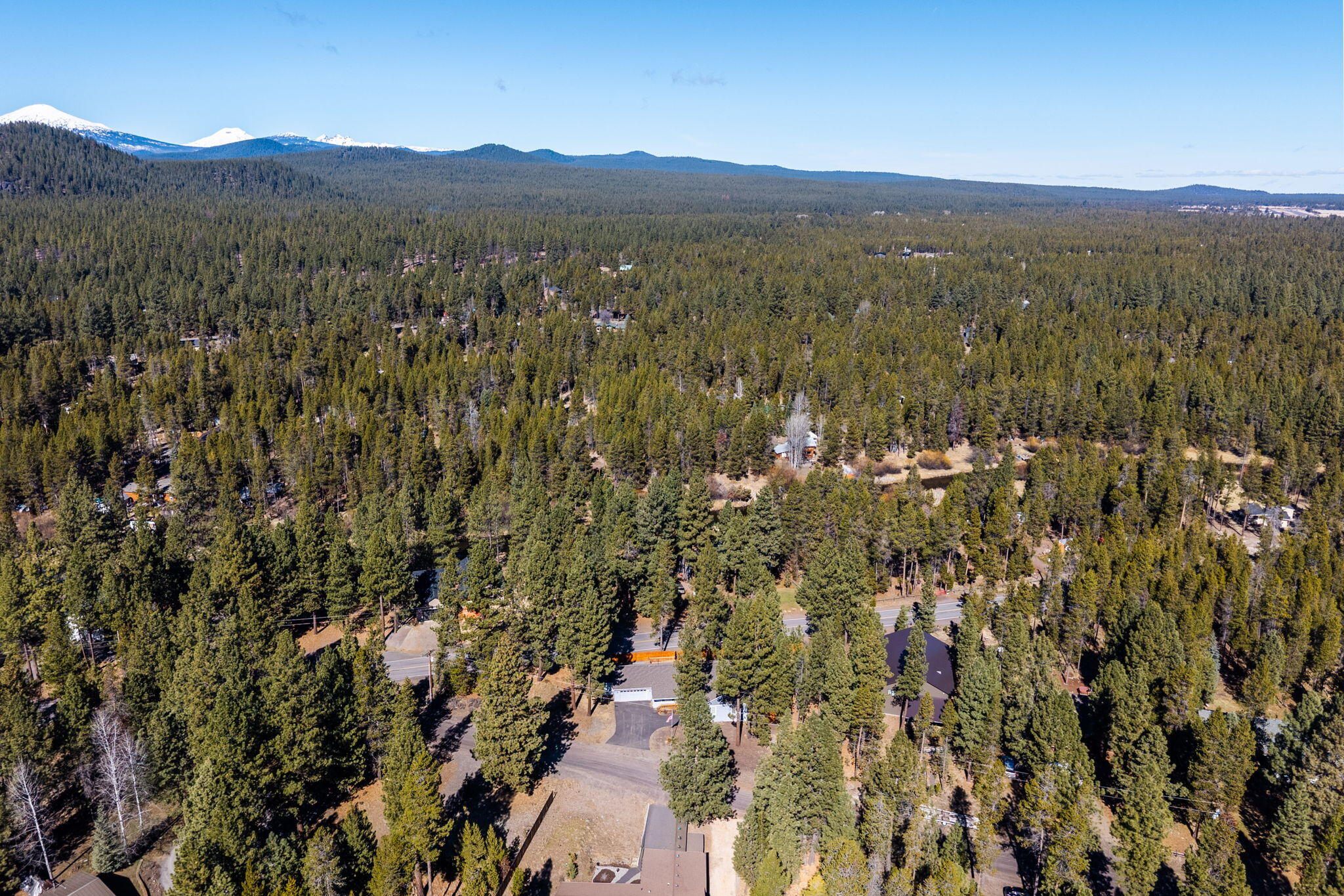 17064 Sacramento Road Bend, OR 97707 - Photo 43 of 50 a view of a lush green hillside and houses