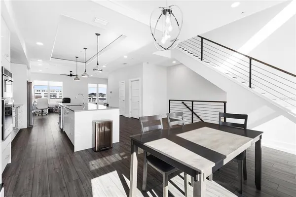 a view of kitchen with cabinets and wooden floor
