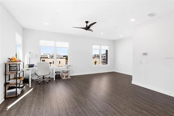 a view of a livingroom with furniture and wooden floor