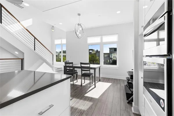 a living room with lots of furniture and a large window
