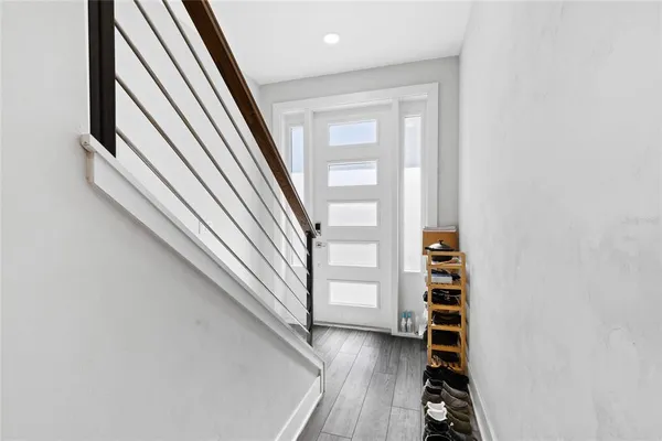 a bed sitting in a room next to a window