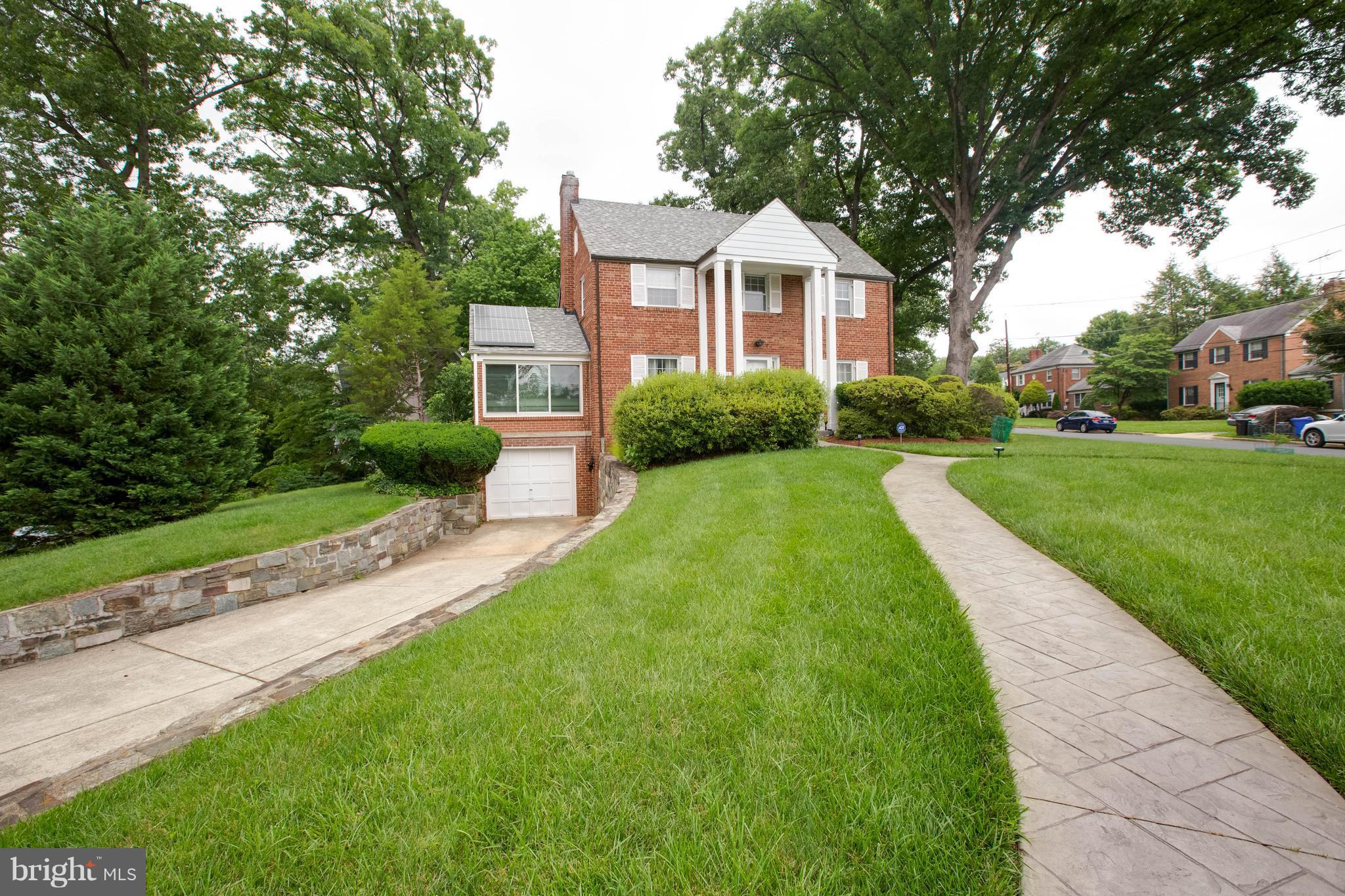 9600 Sutherland Road Silver Spring, MD 20901 - Photo 2 of 30 a front view of a house with yard