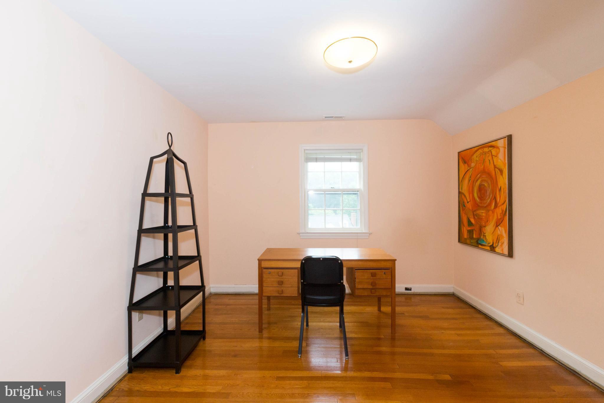 9600 Sutherland Road Silver Spring, MD 20901 - Photo 20 of 30 a view of a livingroom with furniture and wooden floor