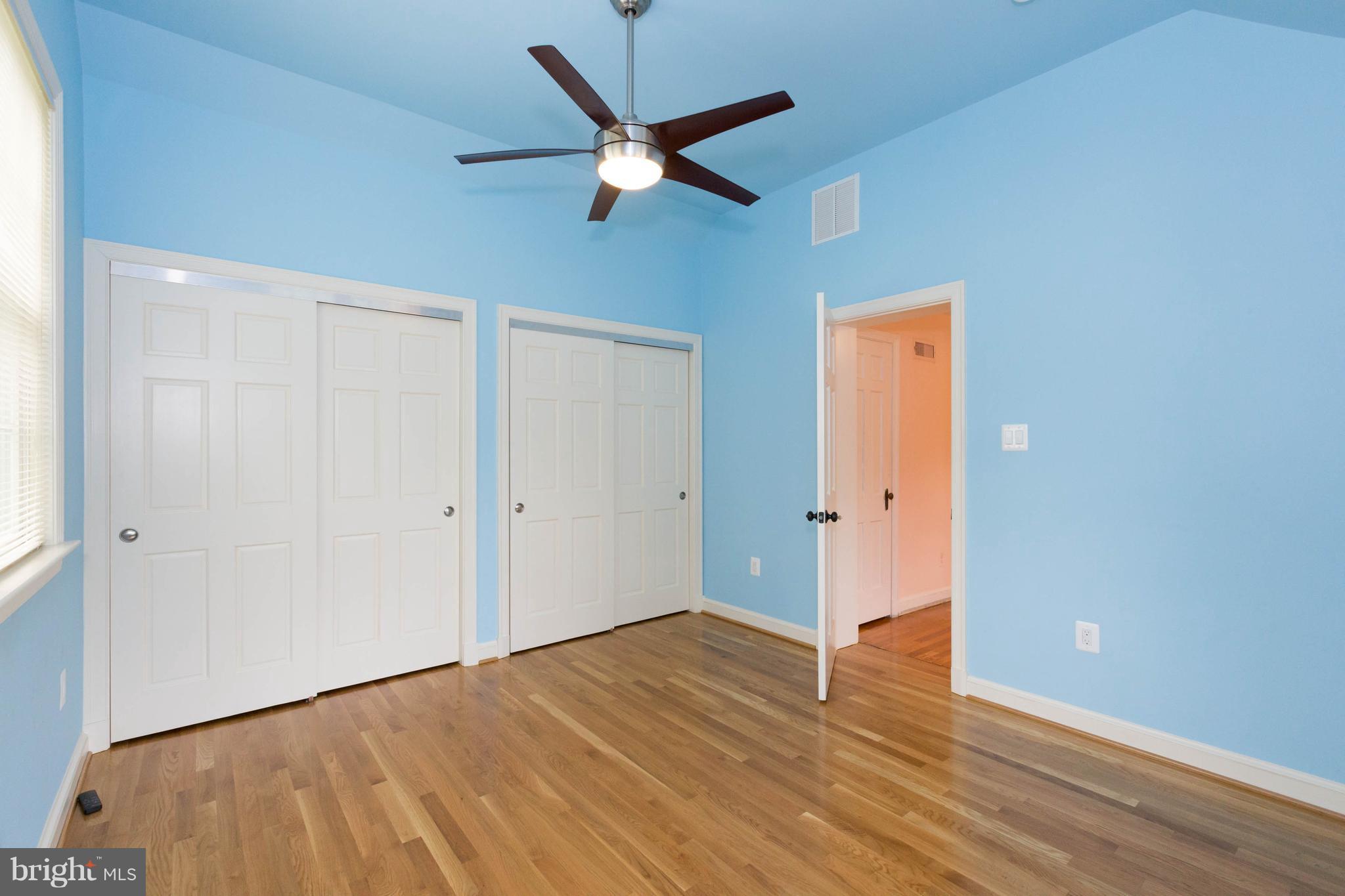9600 Sutherland Road Silver Spring, MD 20901 - Photo 23 of 30 a view of an empty room with wooden floor