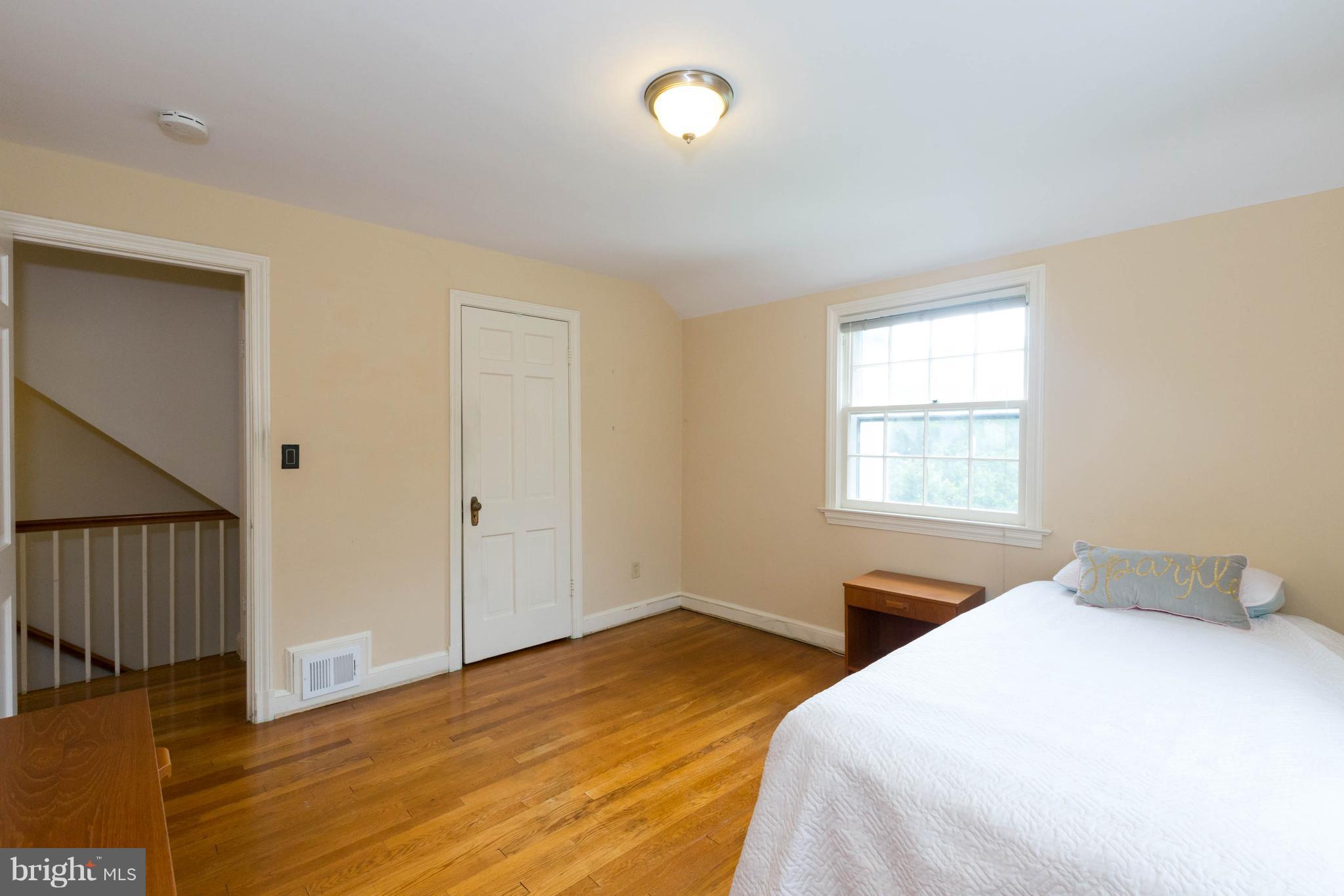 9600 Sutherland Road Silver Spring, MD 20901 - Photo 25 of 30 a bedroom with a bed and a window