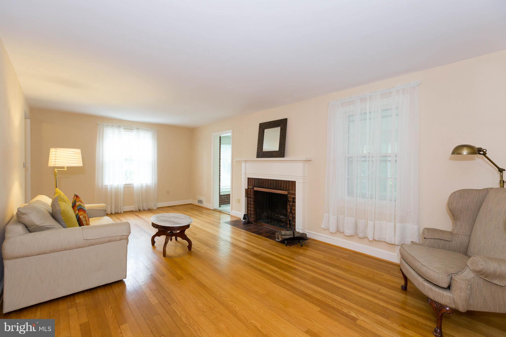 9600 Sutherland Road Silver Spring, MD 20901 - Photo 5 of 30 a living room with furniture and a fireplace