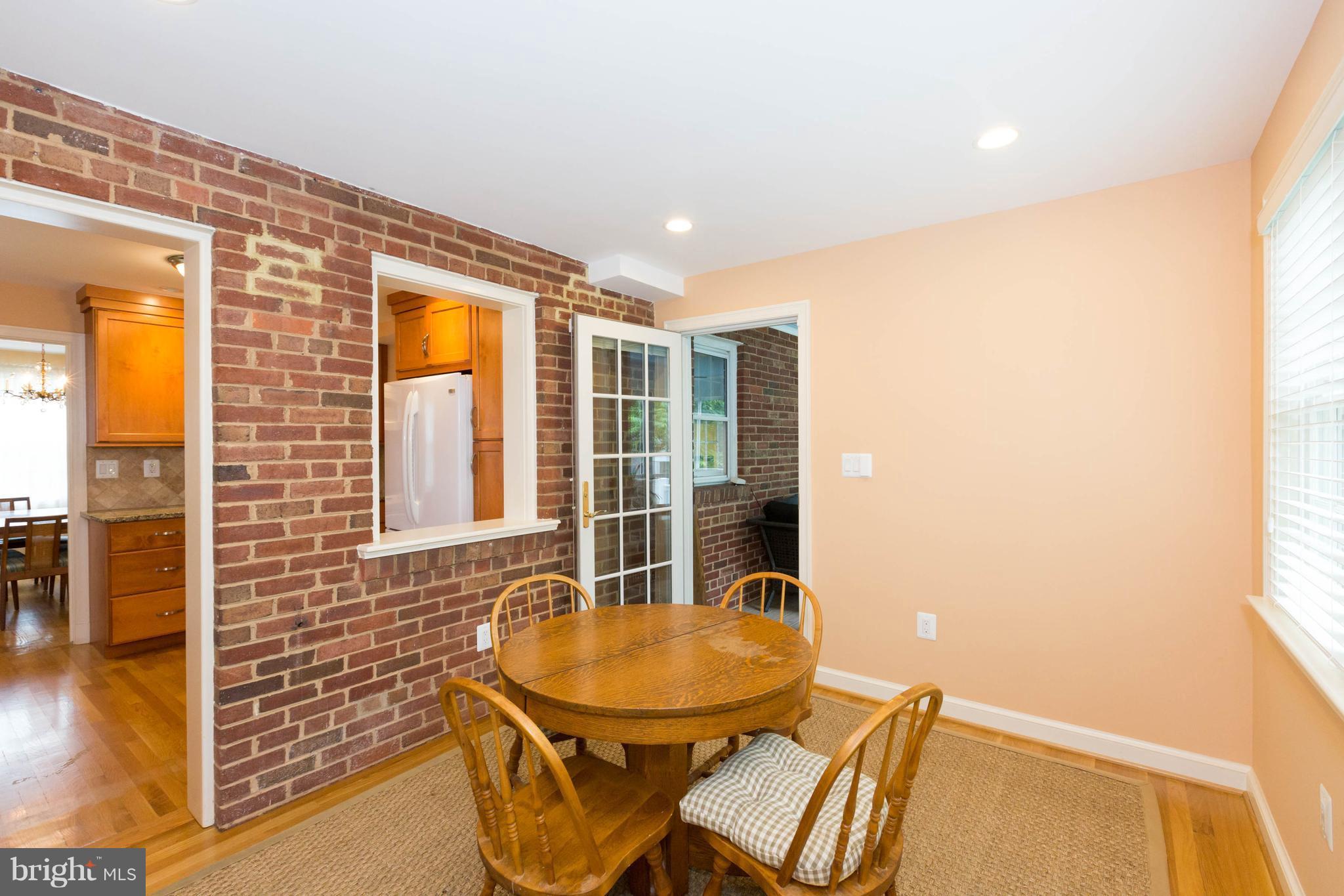 9600 Sutherland Road Silver Spring, MD 20901 - Photo 10 of 30 a view of a dining room with furniture and wooden floor