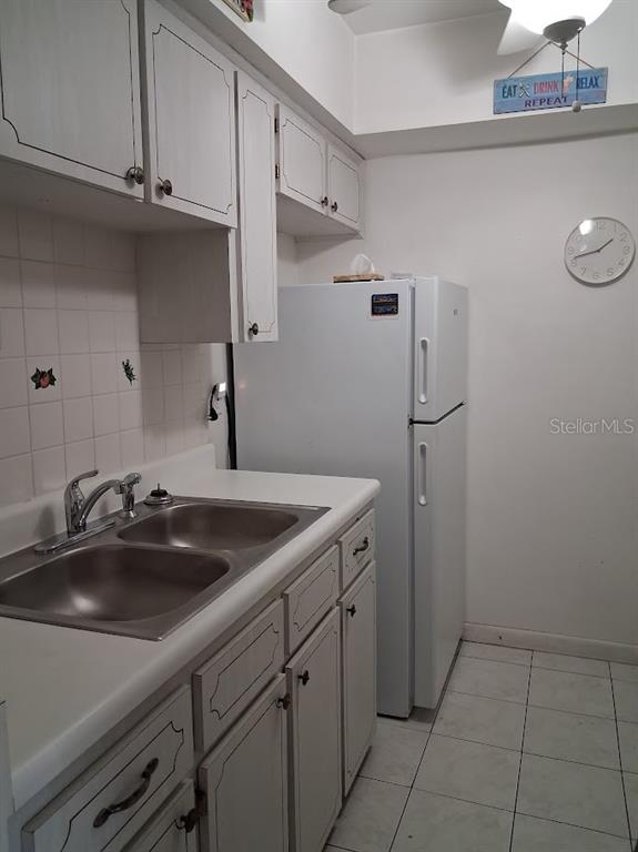 4744 Azalea Drive, Unit 204 New Port Richey, FL 34652 - Photo 7 of 20 a kitchen with a sink and cabinets