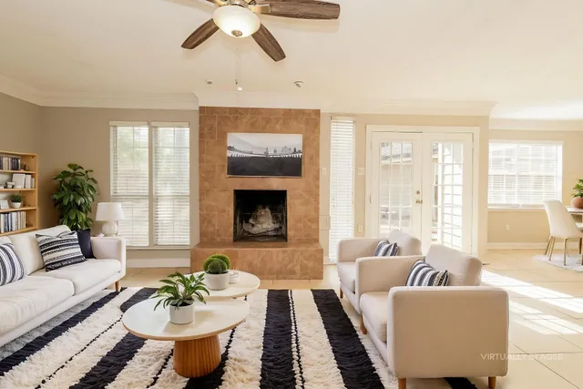 a living room with furniture and a fireplace