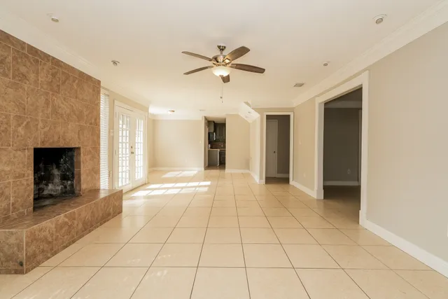 a view of an empty room with a fireplace