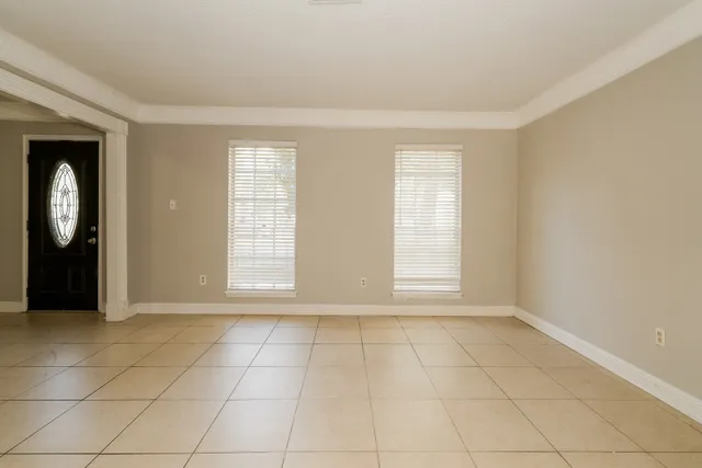 a view of an empty room and window
