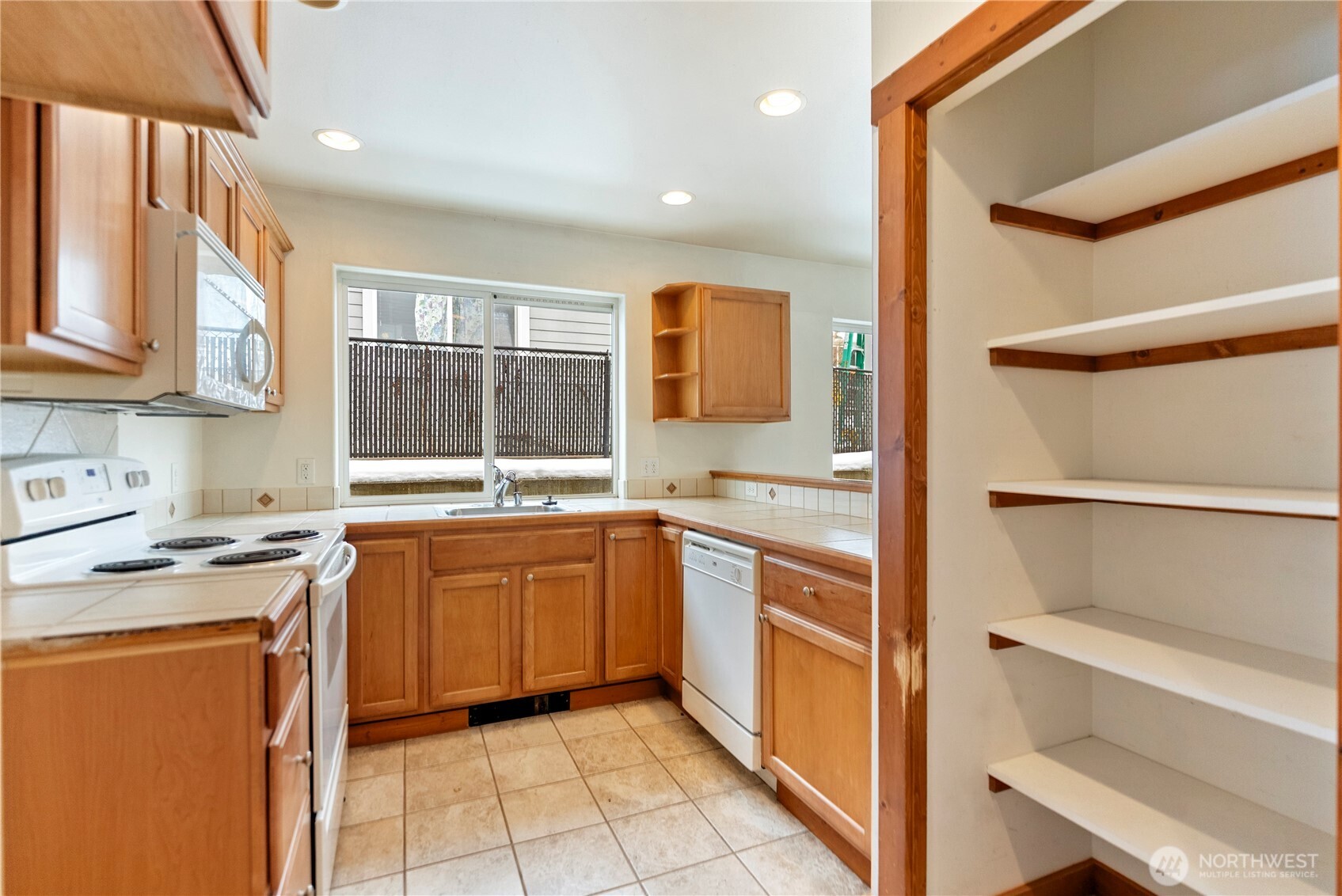 203 Washington Street Winthrop, WA 98862 - Photo 14 of 39 a kitchen with stainless steel appliances granite countertop a sink and cabinets