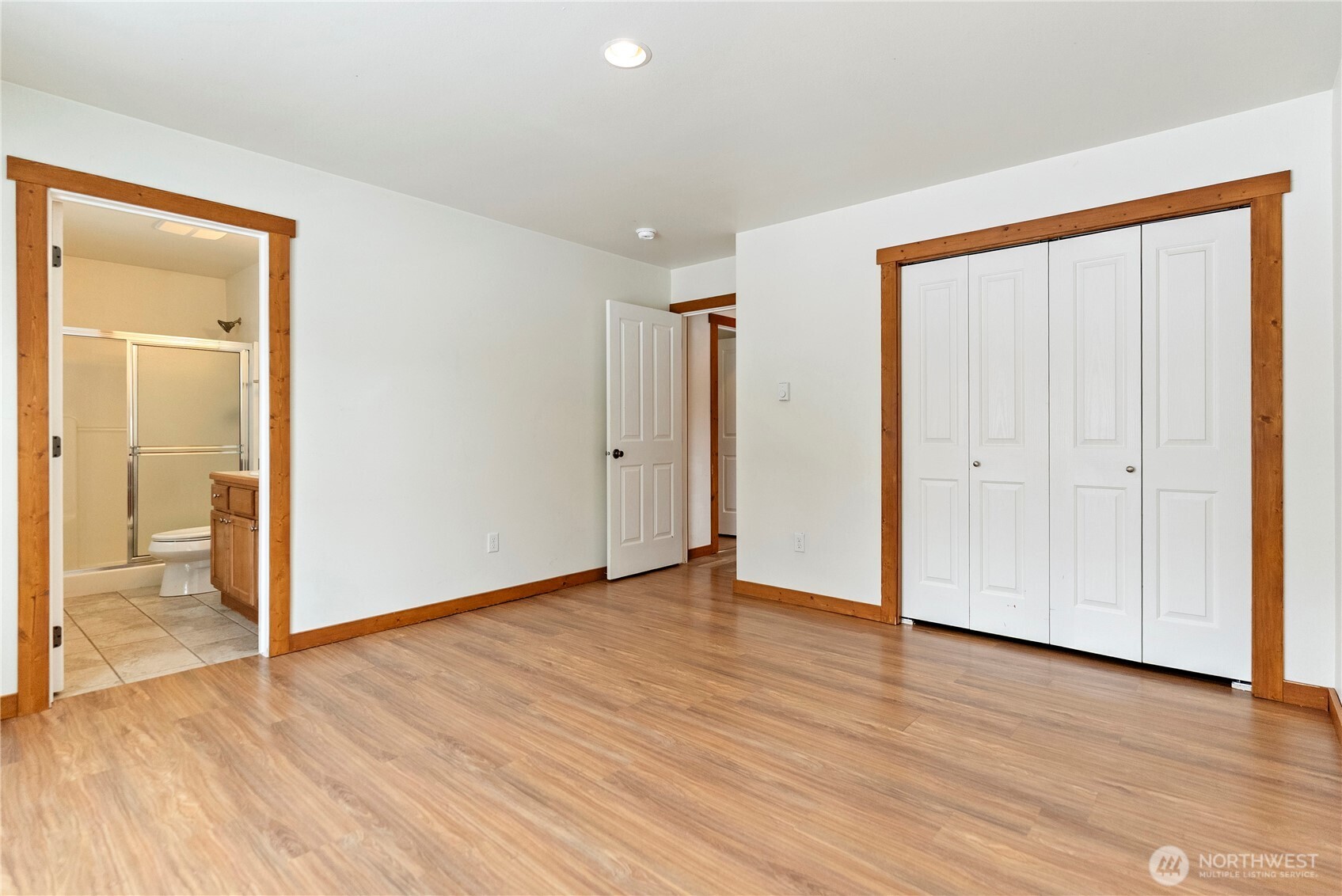 203 Washington Street Winthrop, WA 98862 - Photo 16 of 39 an empty room with wooden floor & windows