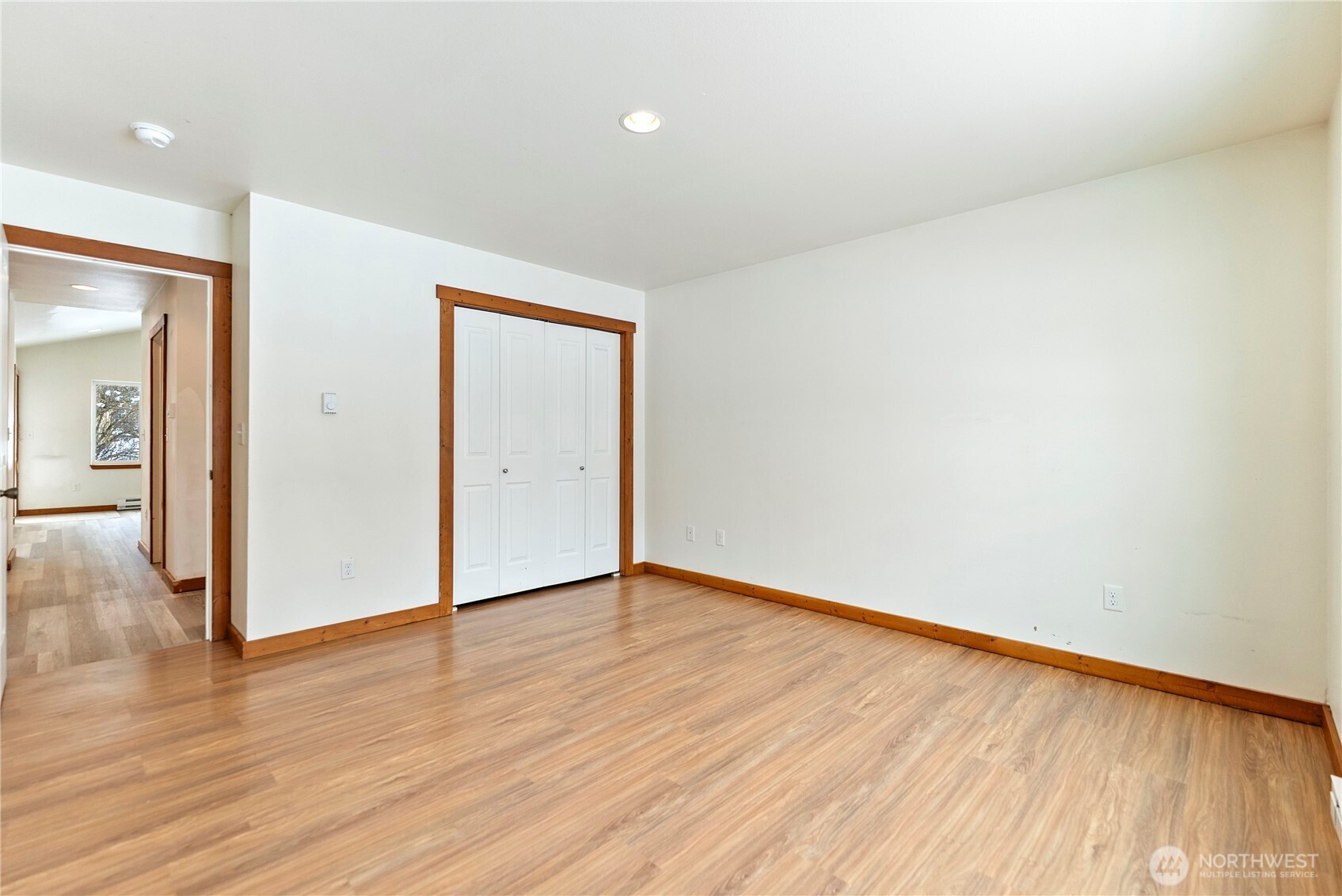 203 Washington Street Winthrop, WA 98862 - Photo 20 of 39 a view of an empty room with wooden floor and a window