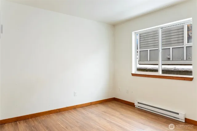 a view of an empty room with a window