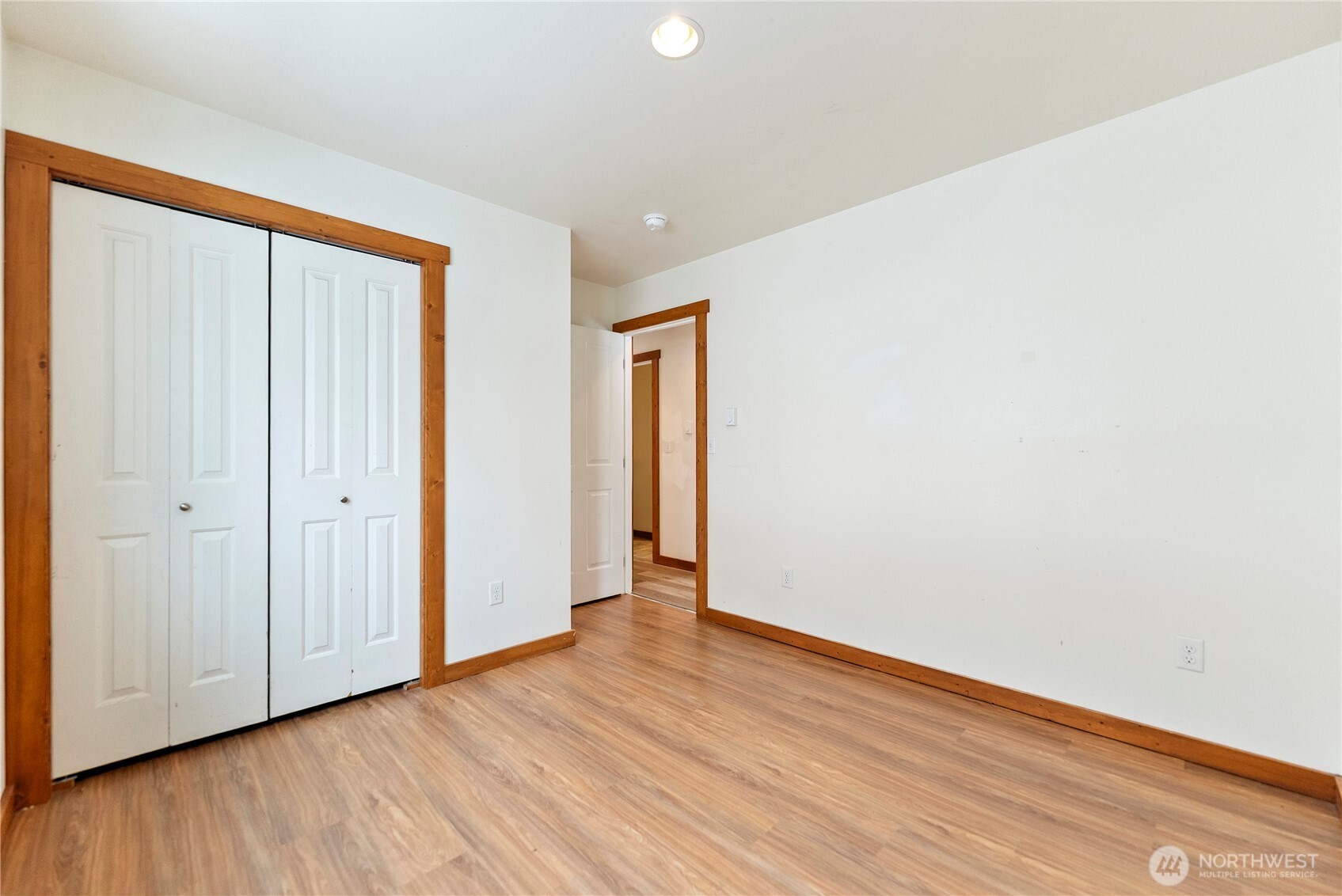 203 Washington Street Winthrop, WA 98862 - Photo 29 of 39 a view of an empty room with wooden floor and a window