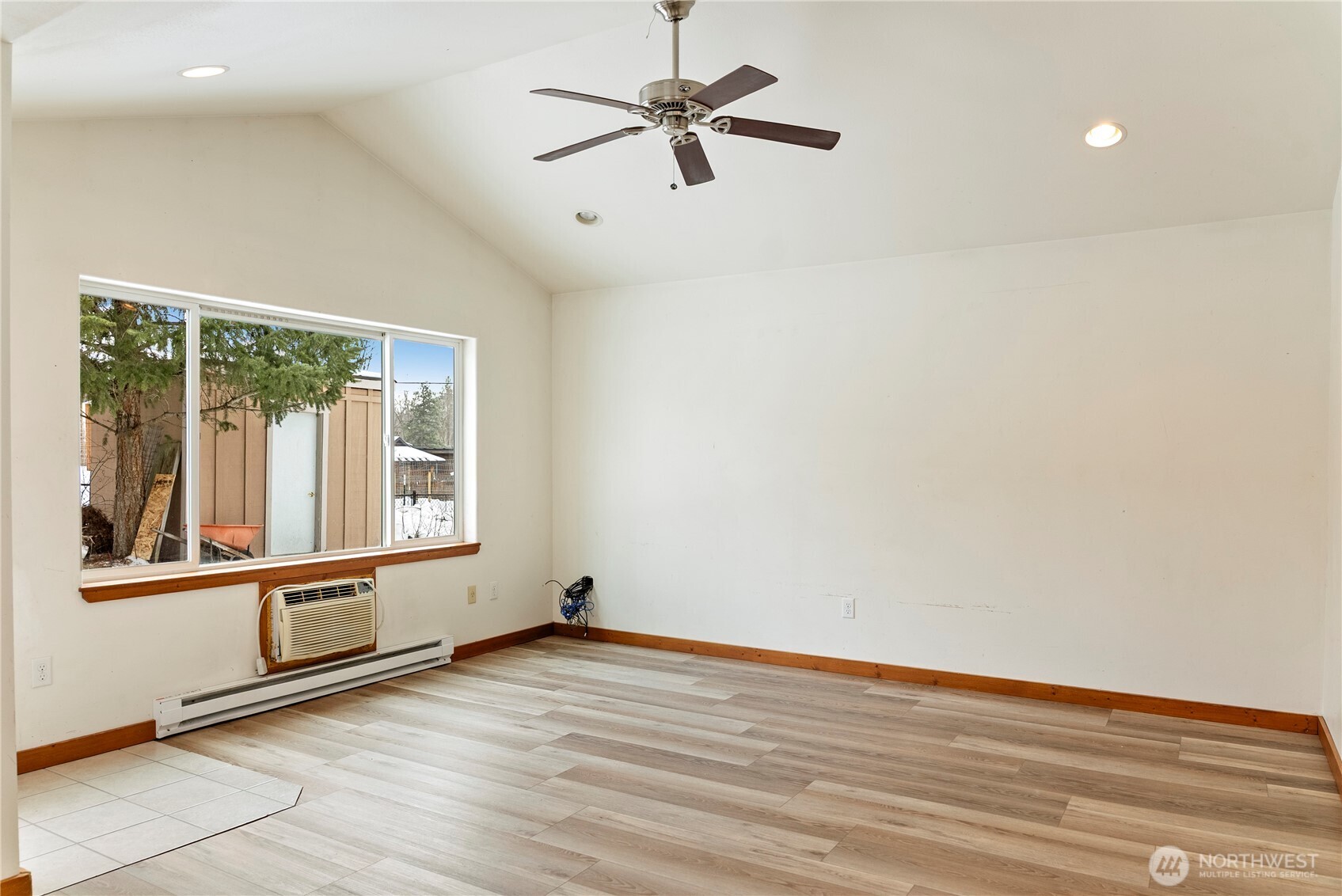 203 Washington Street Winthrop, WA 98862 - Photo 30 of 39 an empty room with wooden floor and windows