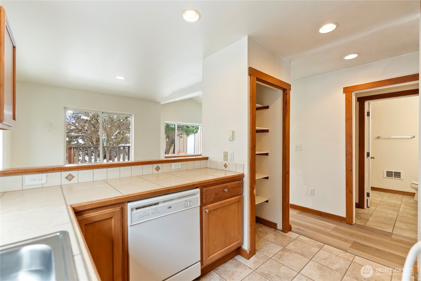 203 Washington Street Winthrop, WA 98862 - Photo 31 of 39 a kitchen with stainless steel appliances granite countertop a refrigerator and a sink