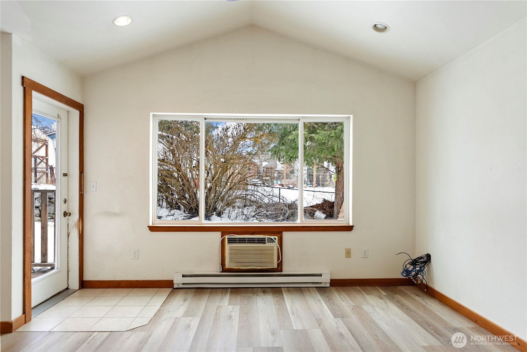 203 Washington Street Winthrop, WA 98862 - Photo 33 of 39 an empty room with wooden floor and windows