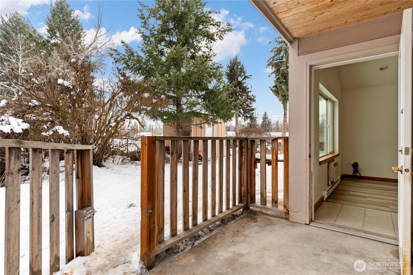 203 Washington Street Winthrop, WA 98862 - Photo 34 of 39 a view of a porch with wooden floor and fence