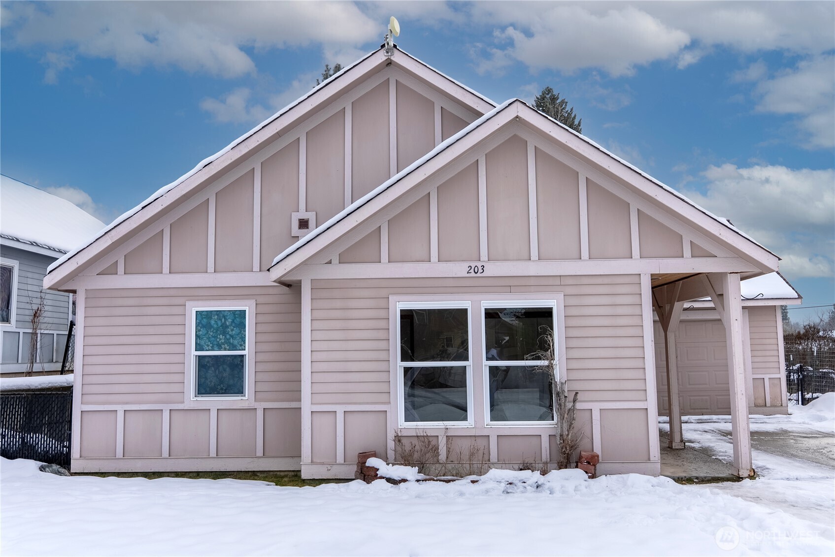 203 Washington Street Winthrop, WA 98862 - Photo 39 of 39 a front view of a house with a yard and parking space