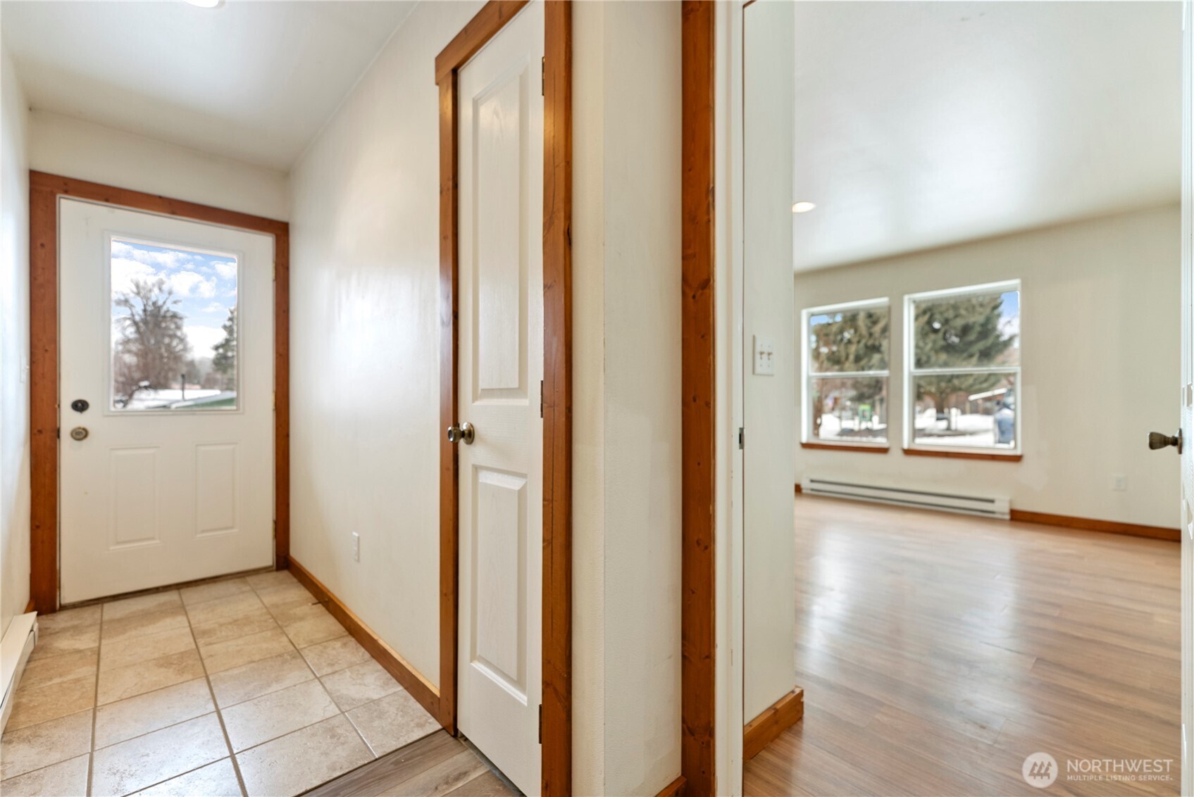 203 Washington Street Winthrop, WA 98862 - Photo 4 of 39 a view of a hallway with wooden floor and a living room